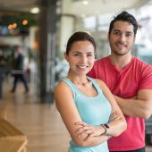 Portrait of a Latin American couple at the gym looking very happy - fitness concepts